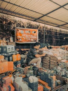 A vibrant local market scene in Malappuram, India showcasing a variety of goods.