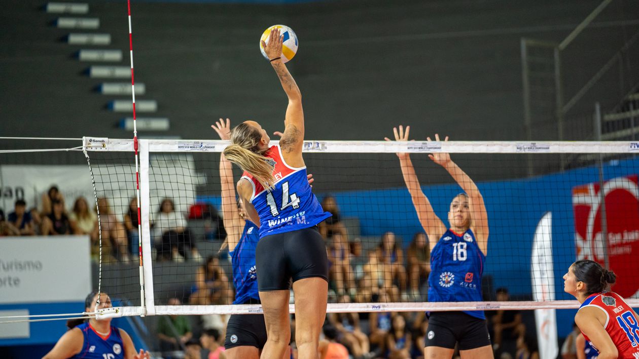 Women's basketball players competing on court