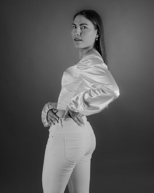 Free Stylish black and white portrait highlighting elegance and fashion in a studio setting. Stock Photo