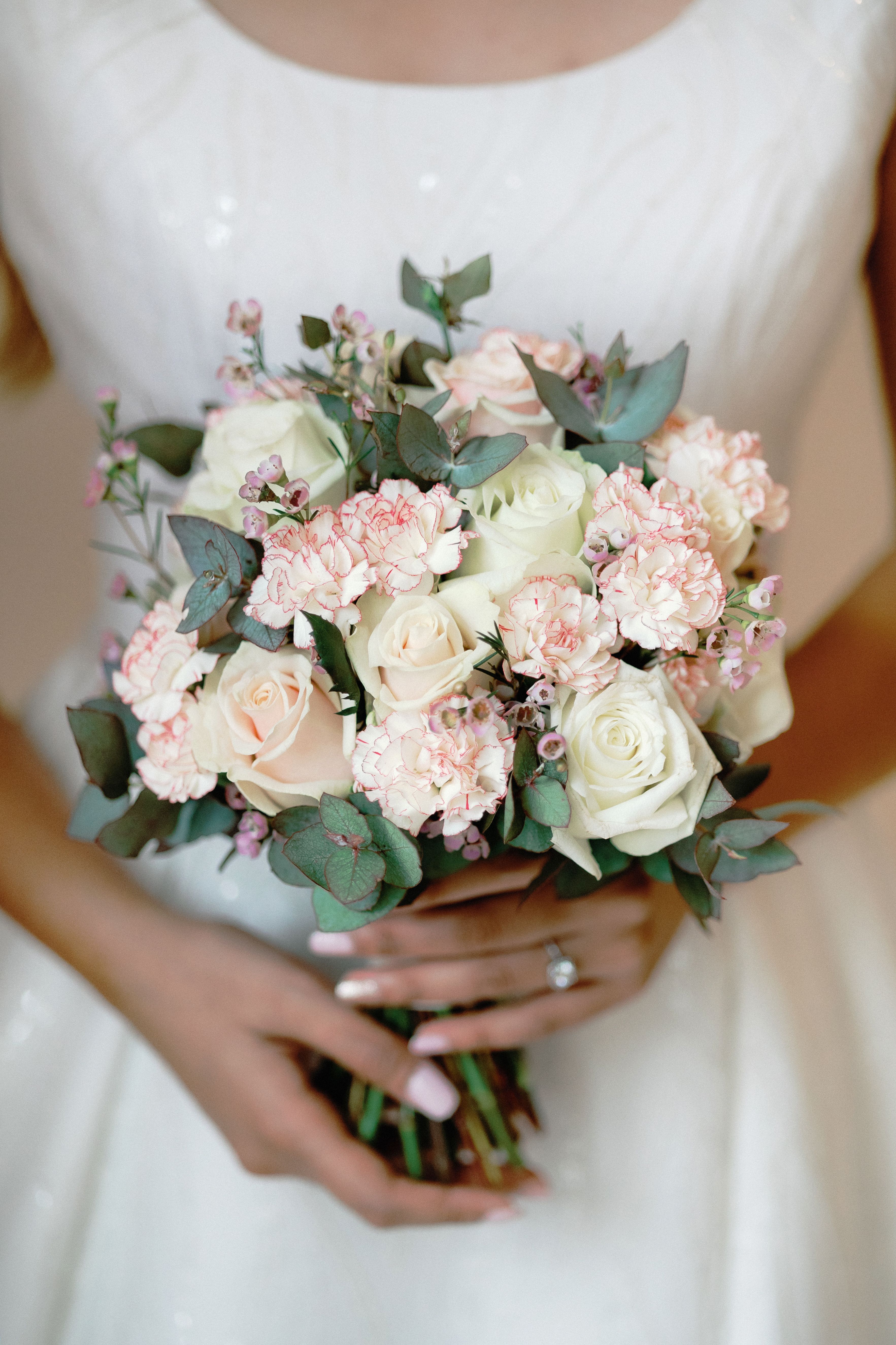 Elegant Bridal Bouquet with Roses and Carnations · Free Stock Photo