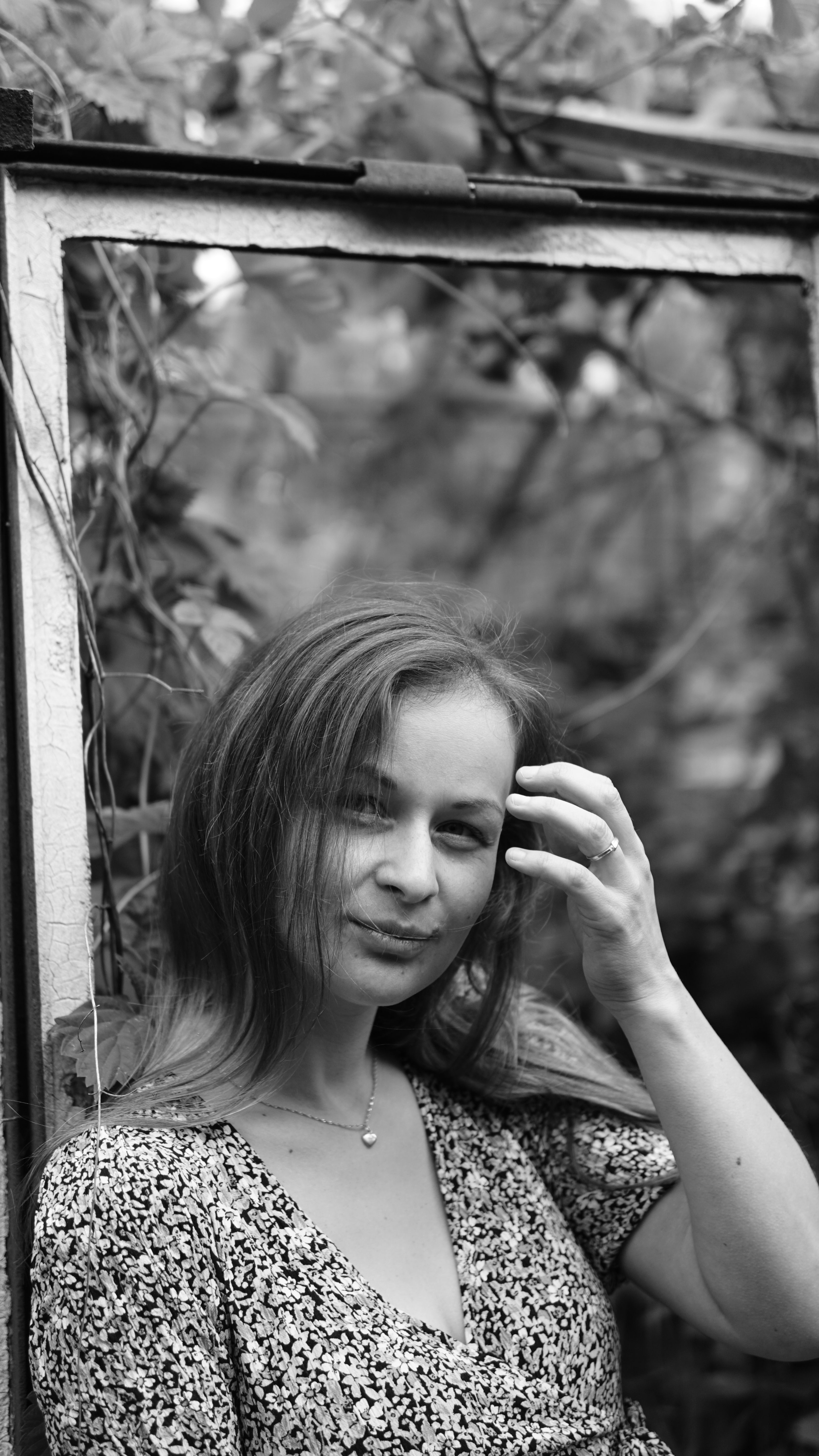 Serene Woman in Black and White Portrait Outdoors · Free Stock Photo
