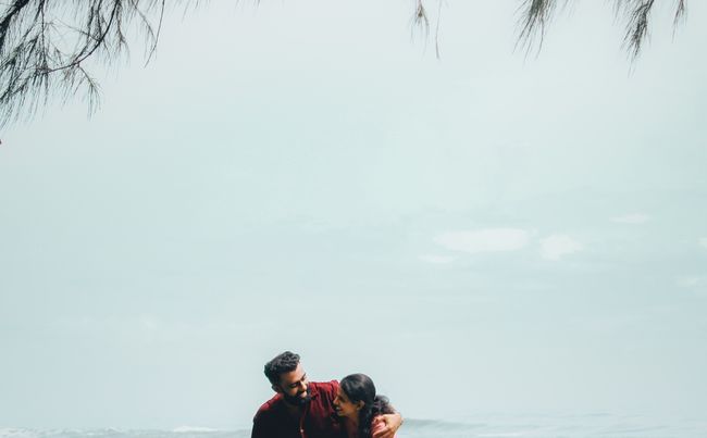 couple with dog traveling in nature
