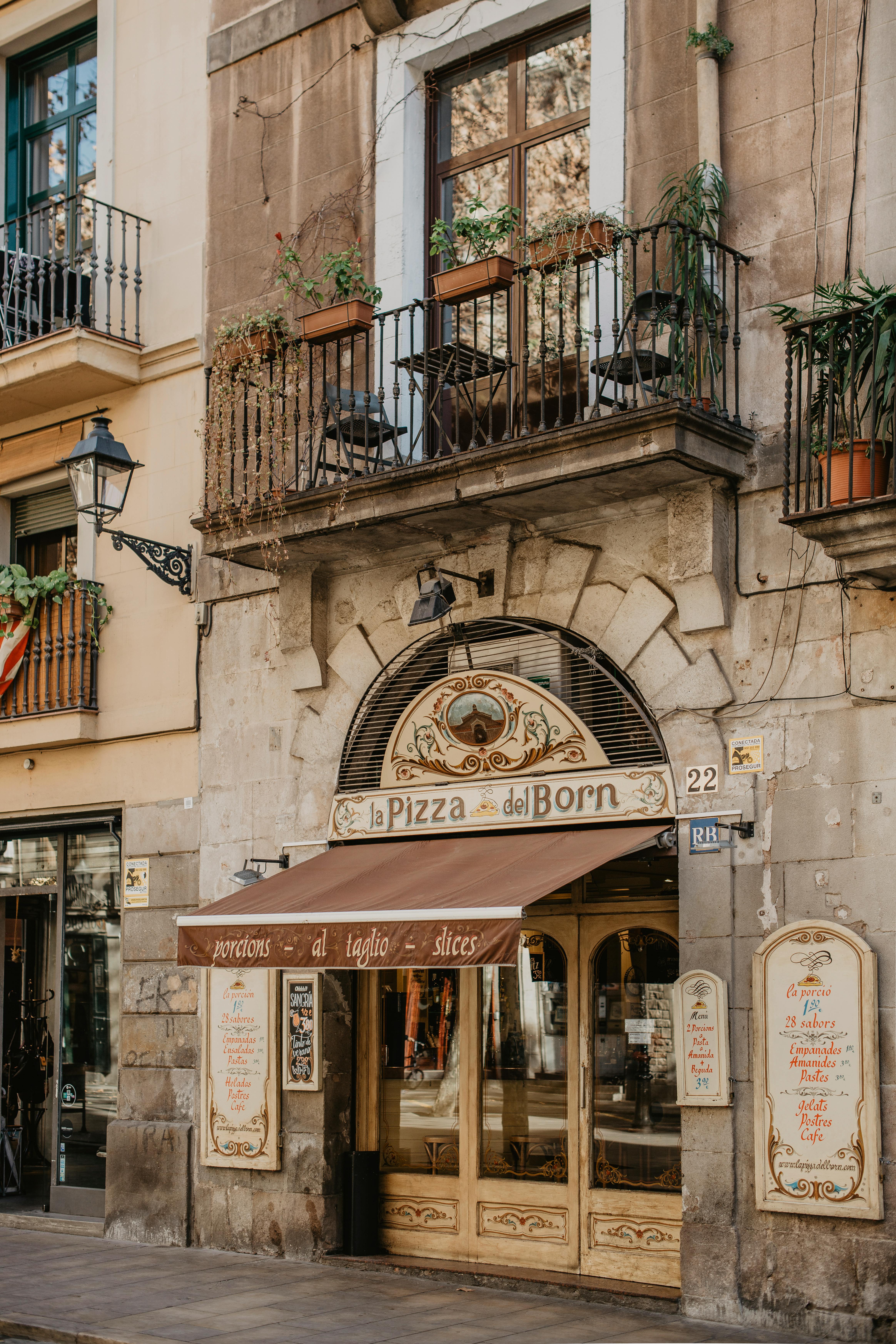 Authentic pizzeria facade in Barcelona's historic Gothic Quarter. Perfect blend of tradition and architecture.