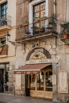 Authentic pizzeria facade in Barcelona's historic Gothic Quarter. Perfect blend of tradition and architecture.