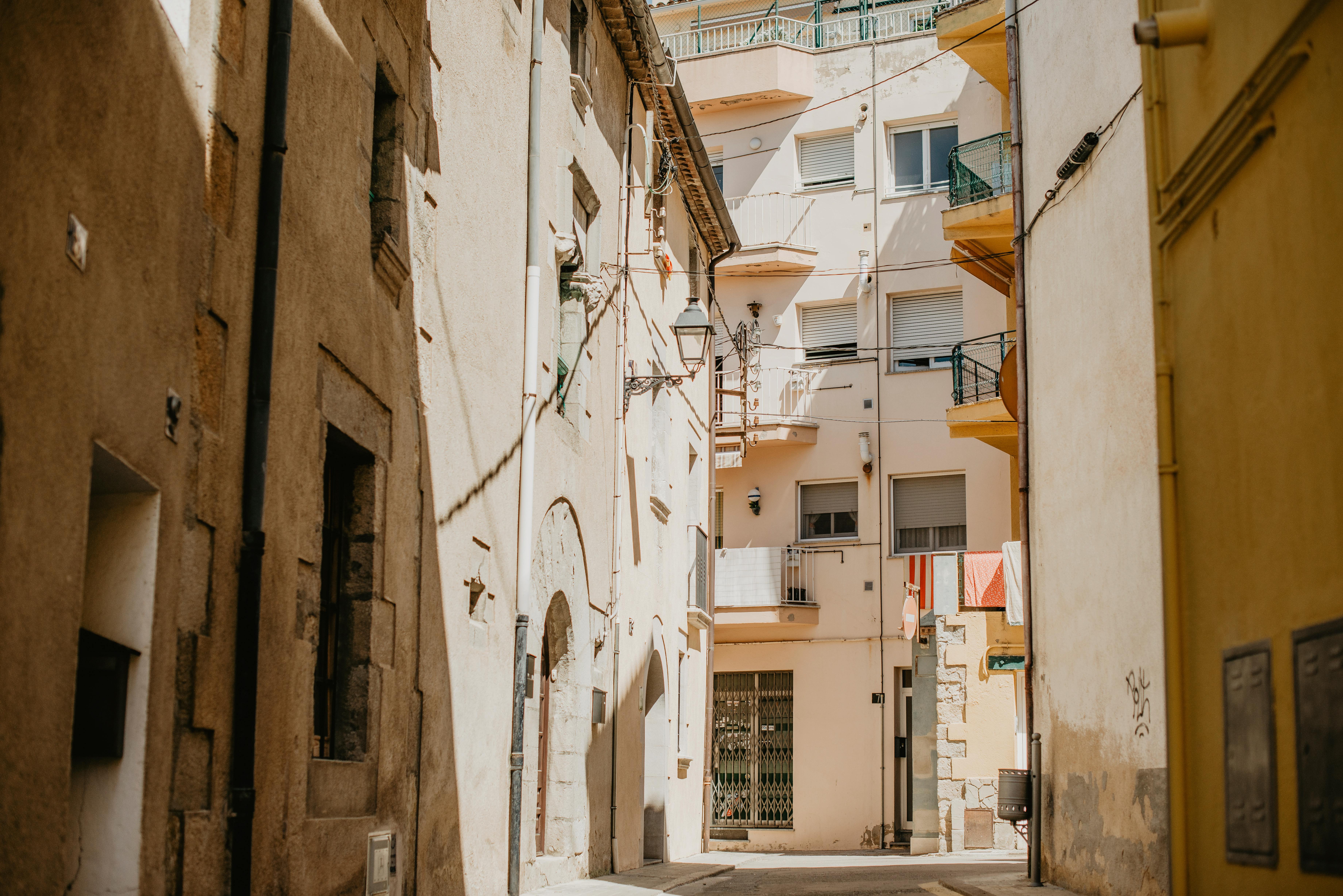 Narrow cobblestone streets with traditional white buildings in Parikia old town