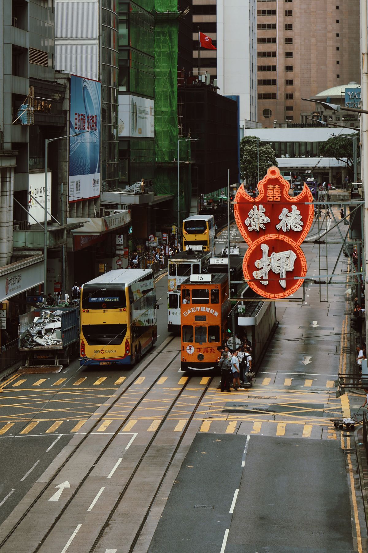Iconic Hong Kong tram passing through a Hong Kong Island street