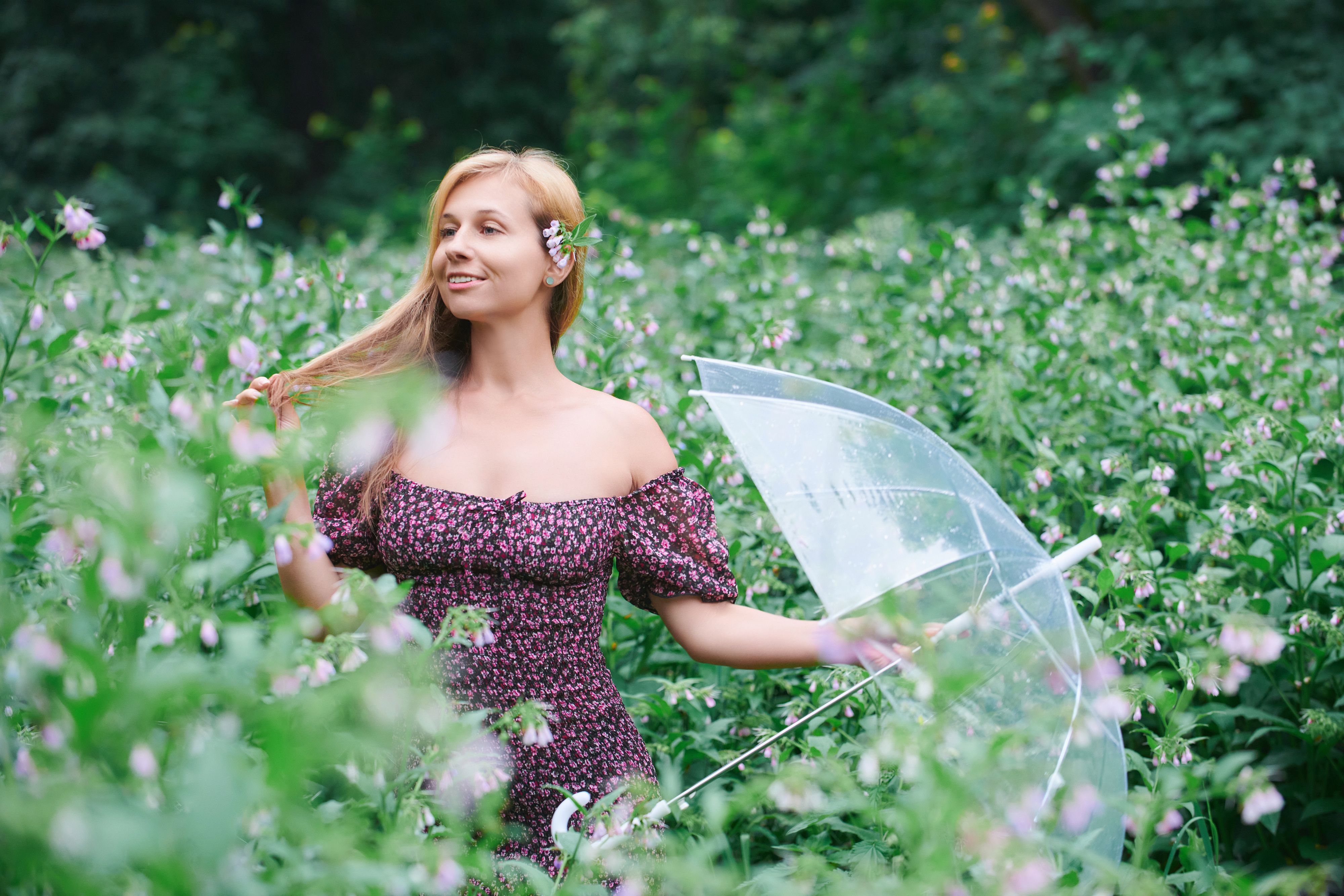 Woman in Floral Dress Enjoys Springtime in Field · Free Stock Photo