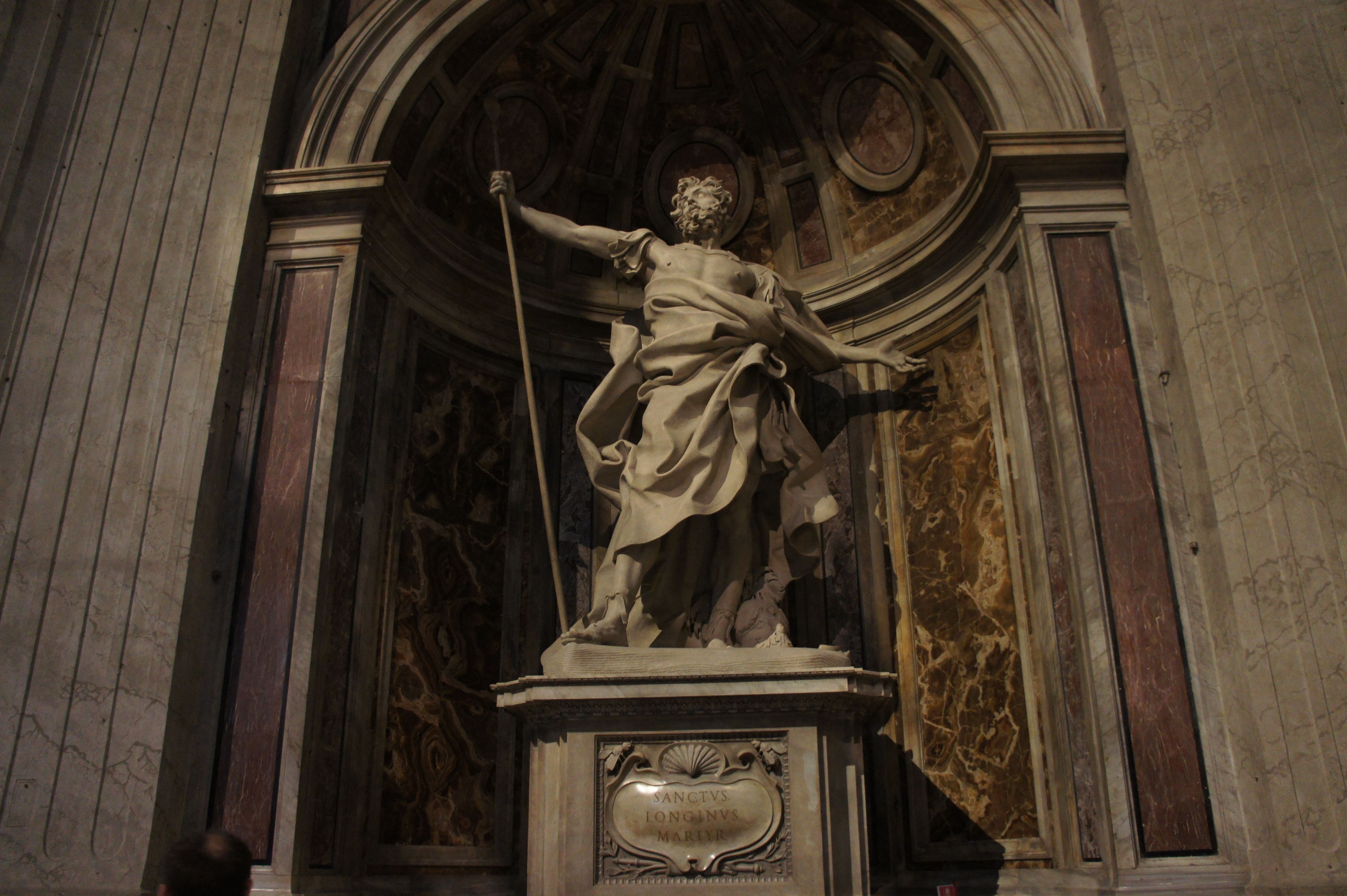 Intricate stone sculpture in a grand indoor setting, showcasing artistic craftsmanship.