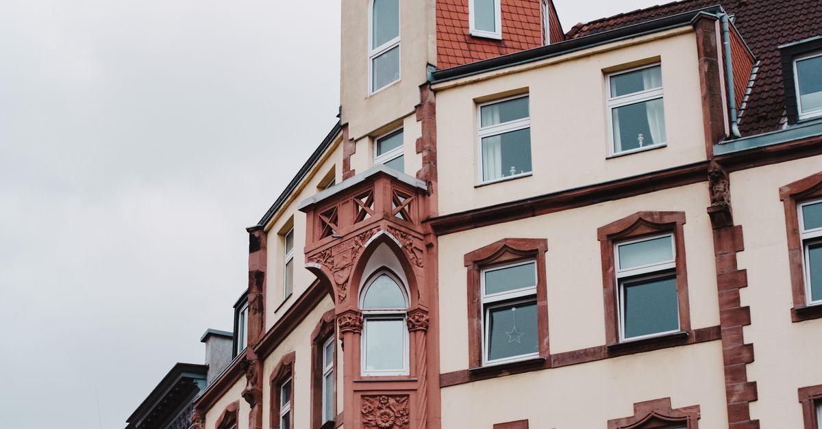 Detailed view of an ornate historic building facade showcasing intricate architectural designs.