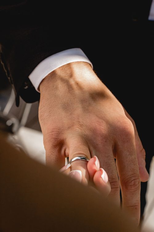 Free Detailed view of a wedding ring being exchanged, symbolizing love and commitment. Stock Photo