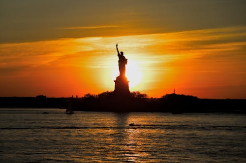 Free stock photo of new york, statue of liberty, sunset