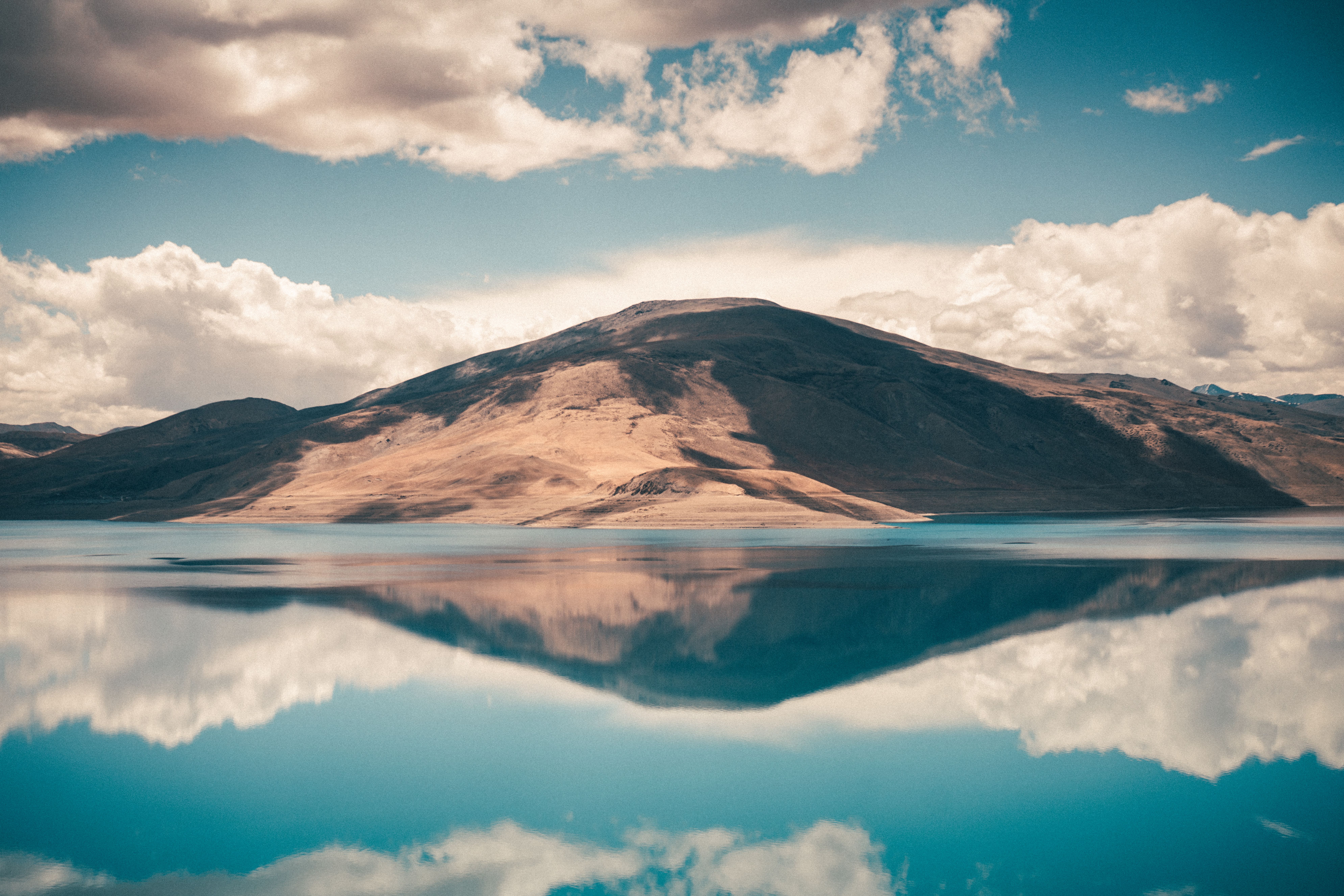 Tranquil Mountain Lake Reflection Under Blue Sky · Free Stock Photo