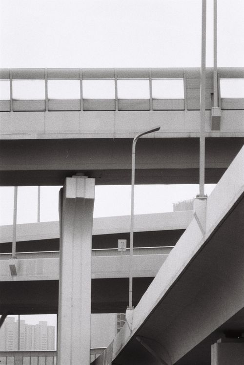 Free Abstract black and white view of a concrete highway overpass. Stock Photo