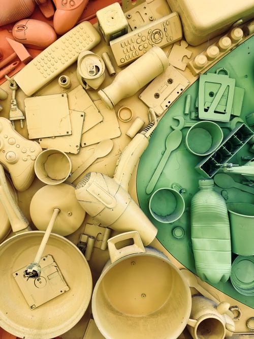 Free An artistic flat-lay of colorful plastic household items arranged creatively. Stock Photo