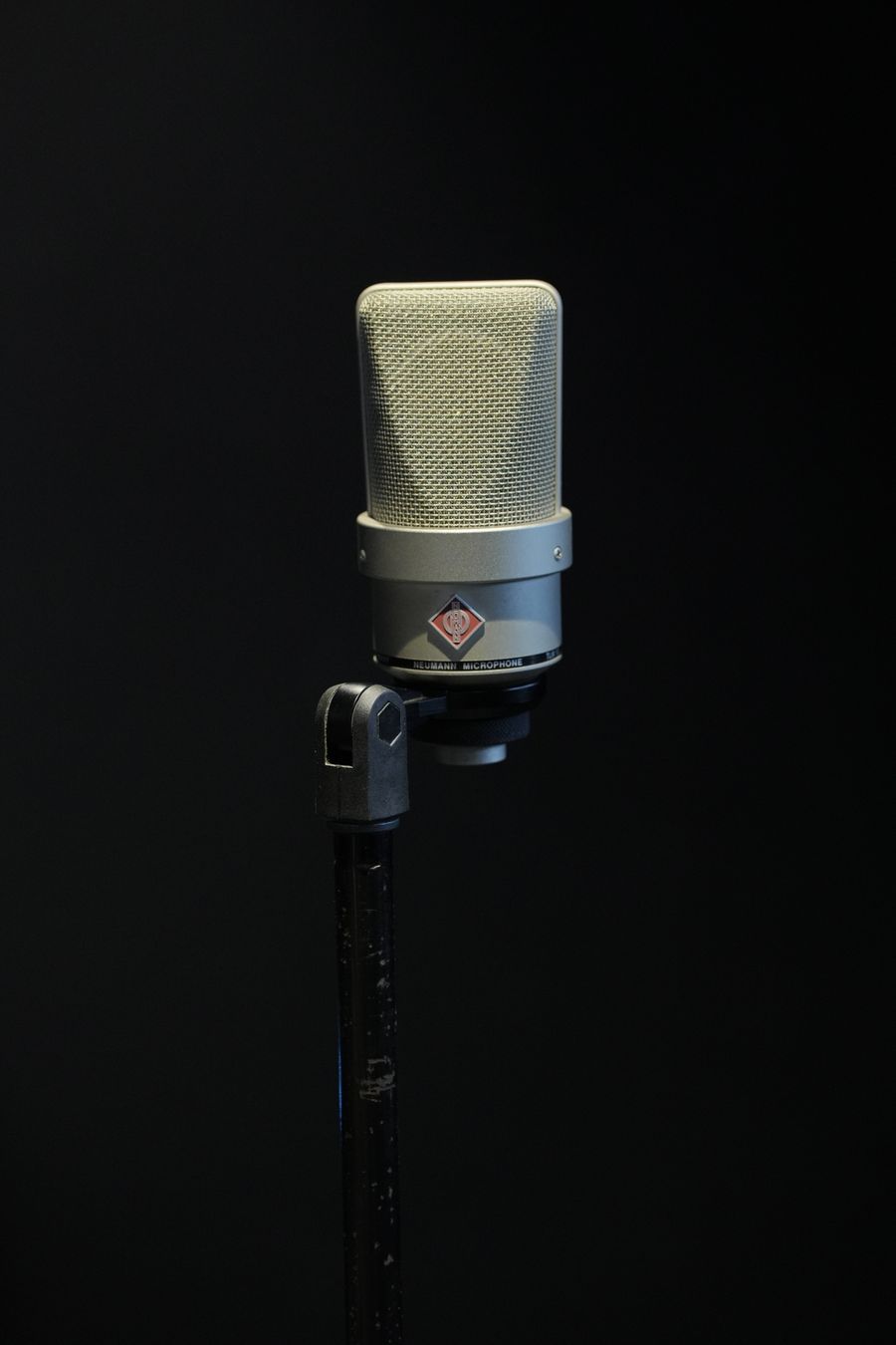Close-up of a studio microphone on a dark background