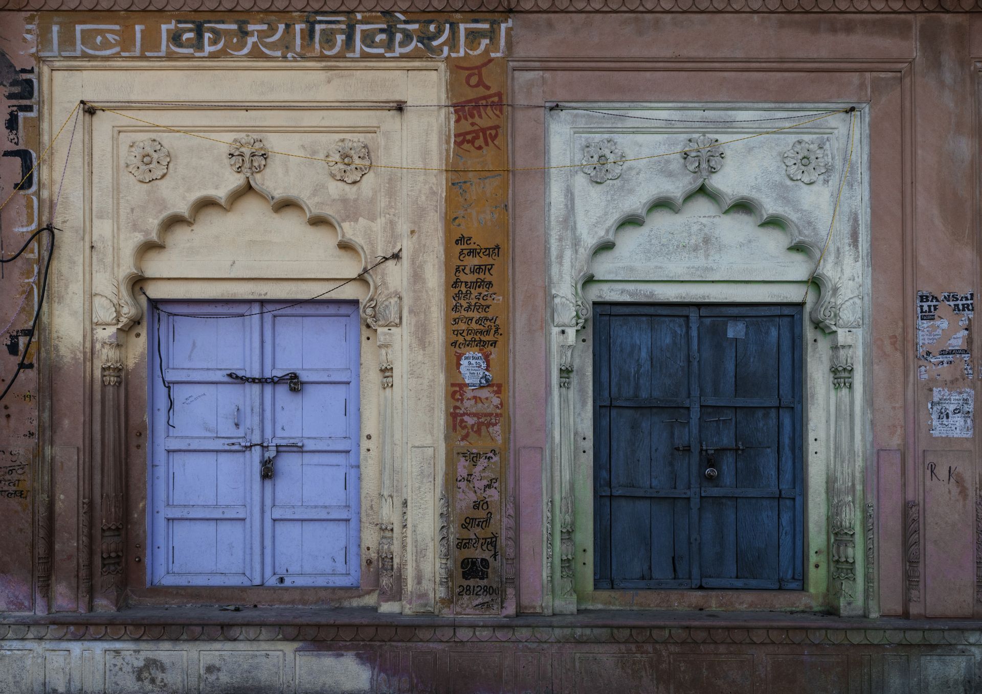 Two vibrant traditional doors in Gobardhan, Uttar Pradesh, India.