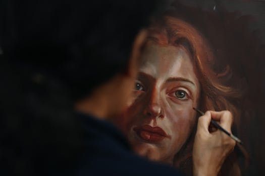 An artist skillfully paints a realistic portrait of a woman on canvas.