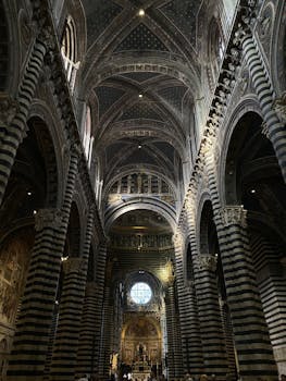 Explore the majestic gothic interiors of Siena Cathedral in Tuscany, Italy.