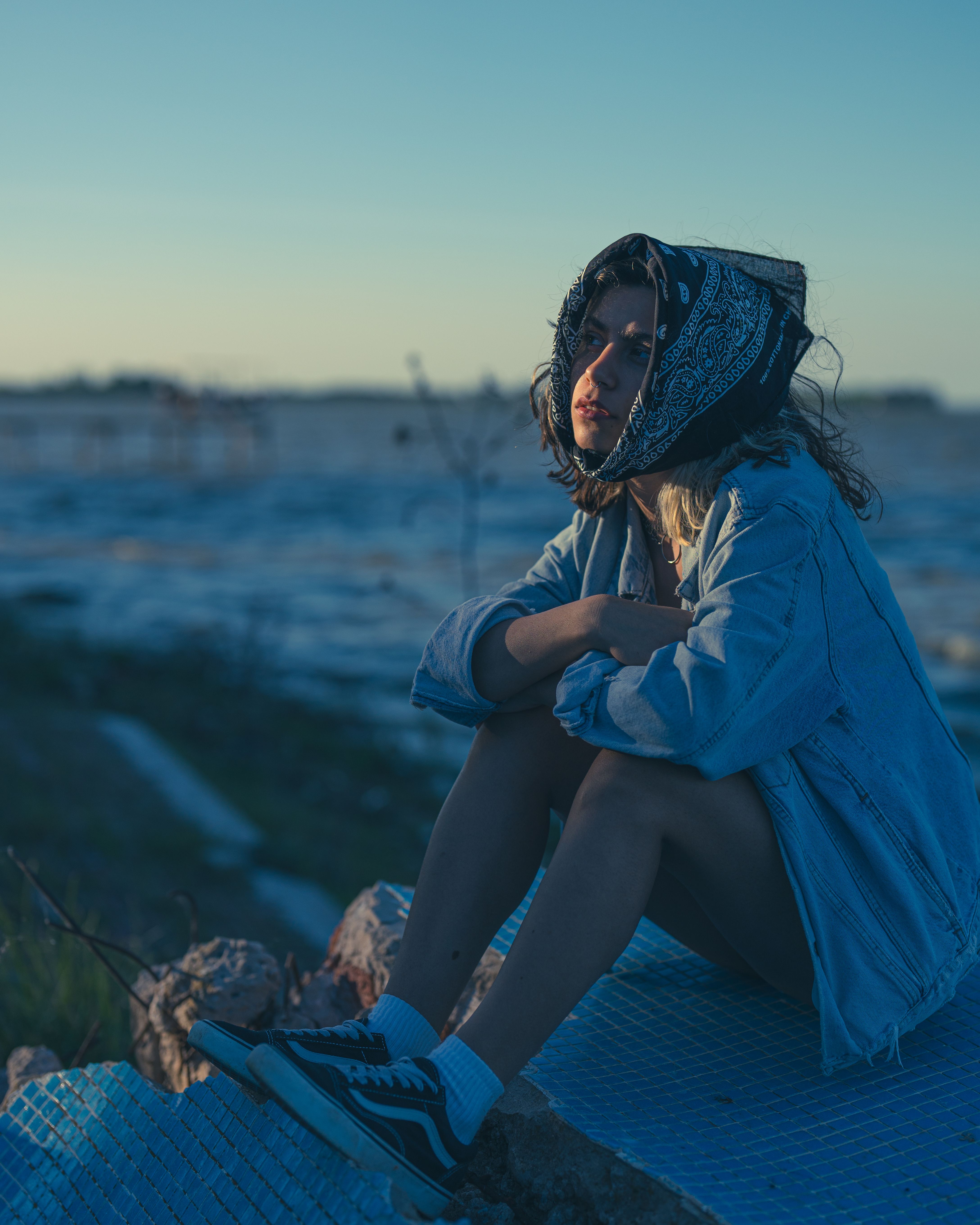 Contemplative Woman by the Lake at Sunset · Free Stock Photo