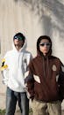 Young Adults in Stylish Hoodies Outdoors