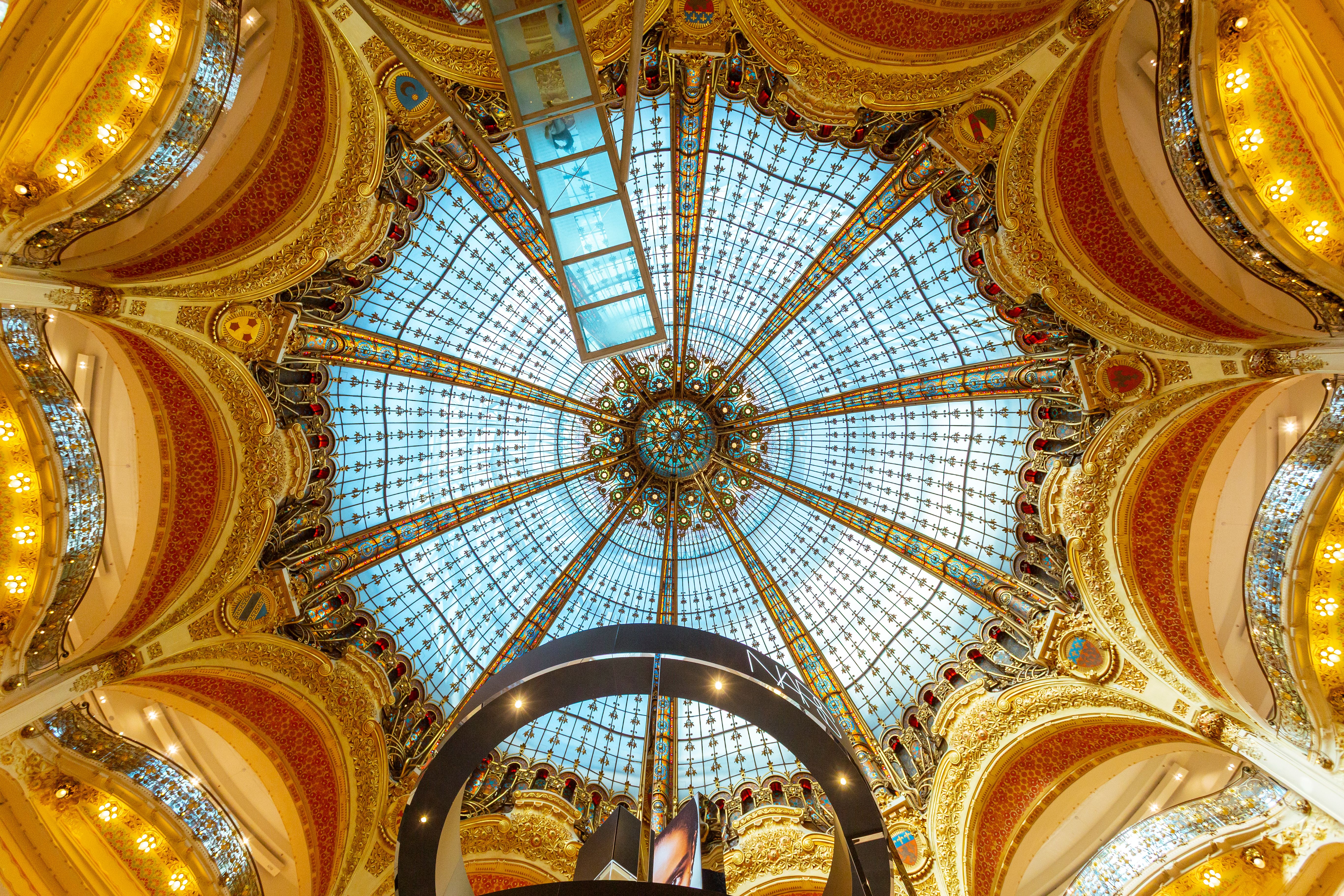 Captivating view of the ornate Art Nouveau dome at Galeries Lafayette, Paris.