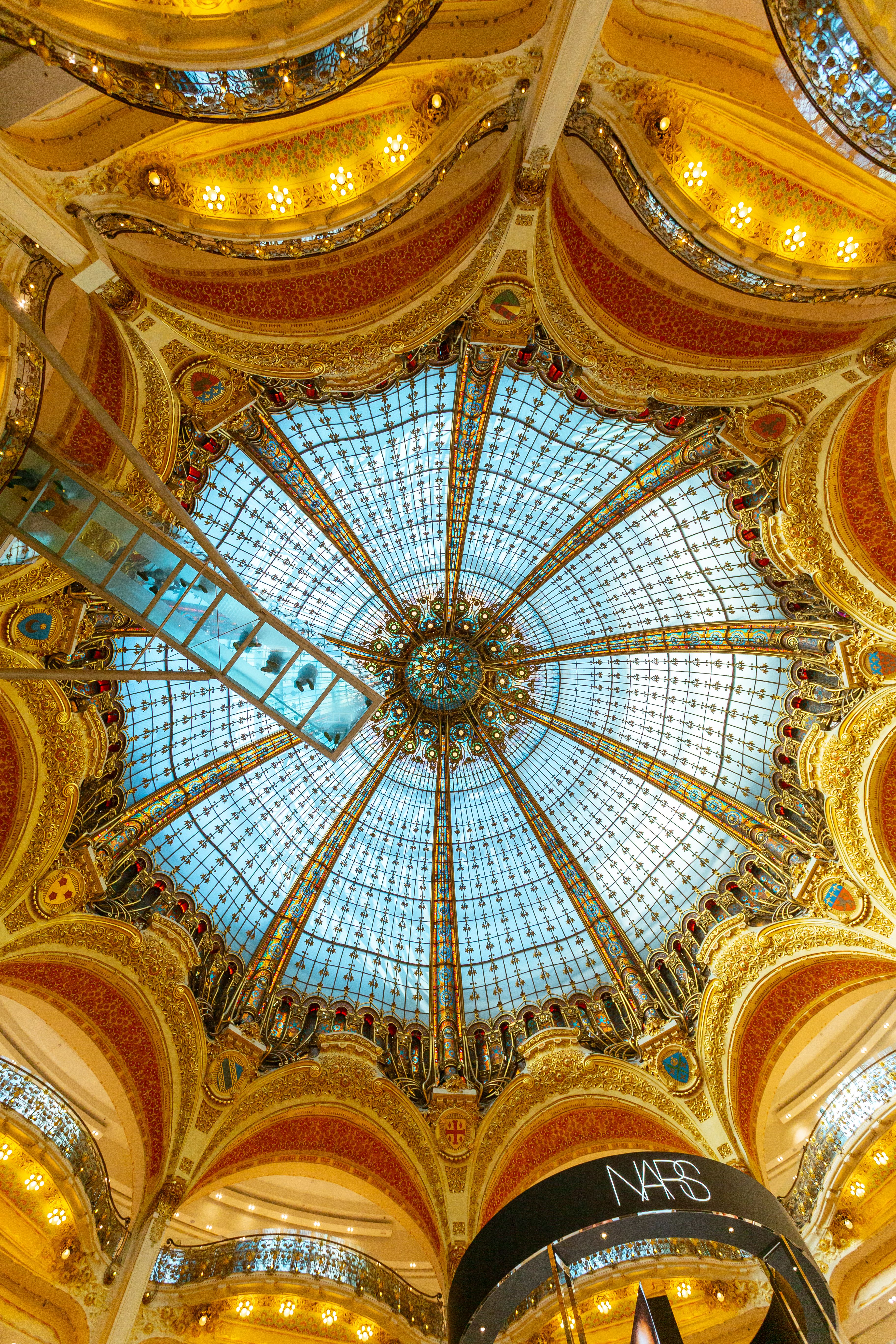 The glass dome of Galeries Lafayette in Paris, host city of NRF Europe 2026