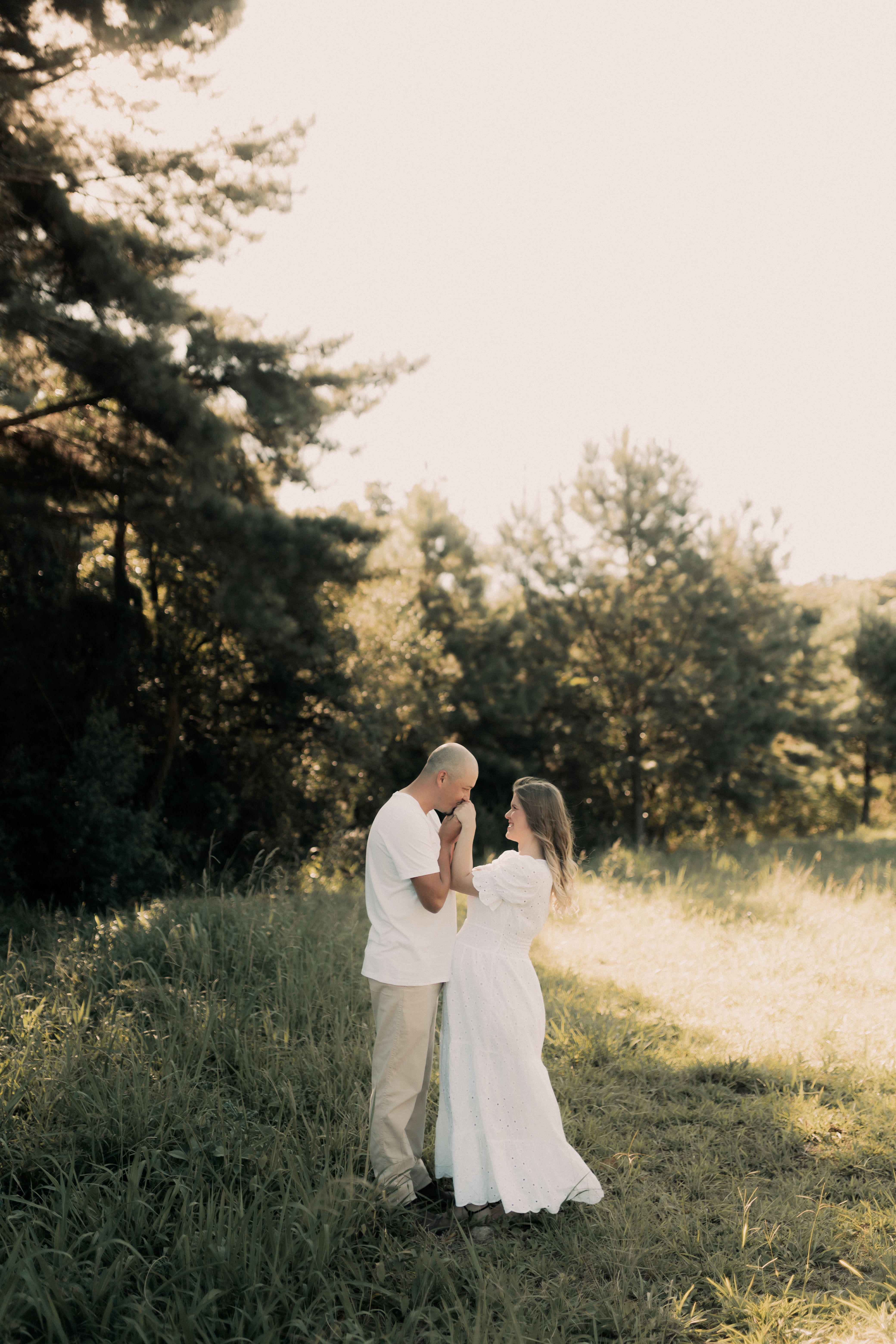 Romantic Couple in Sunlit Summer Meadow · Free Stock Photo
