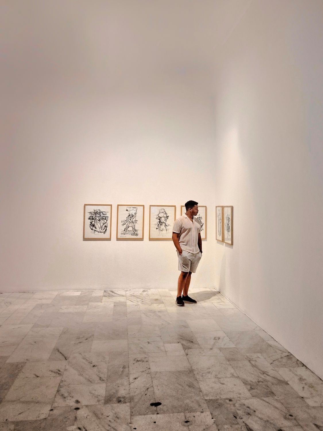 Contemplating Art in Minimalist Gallery · Free Stock Photo