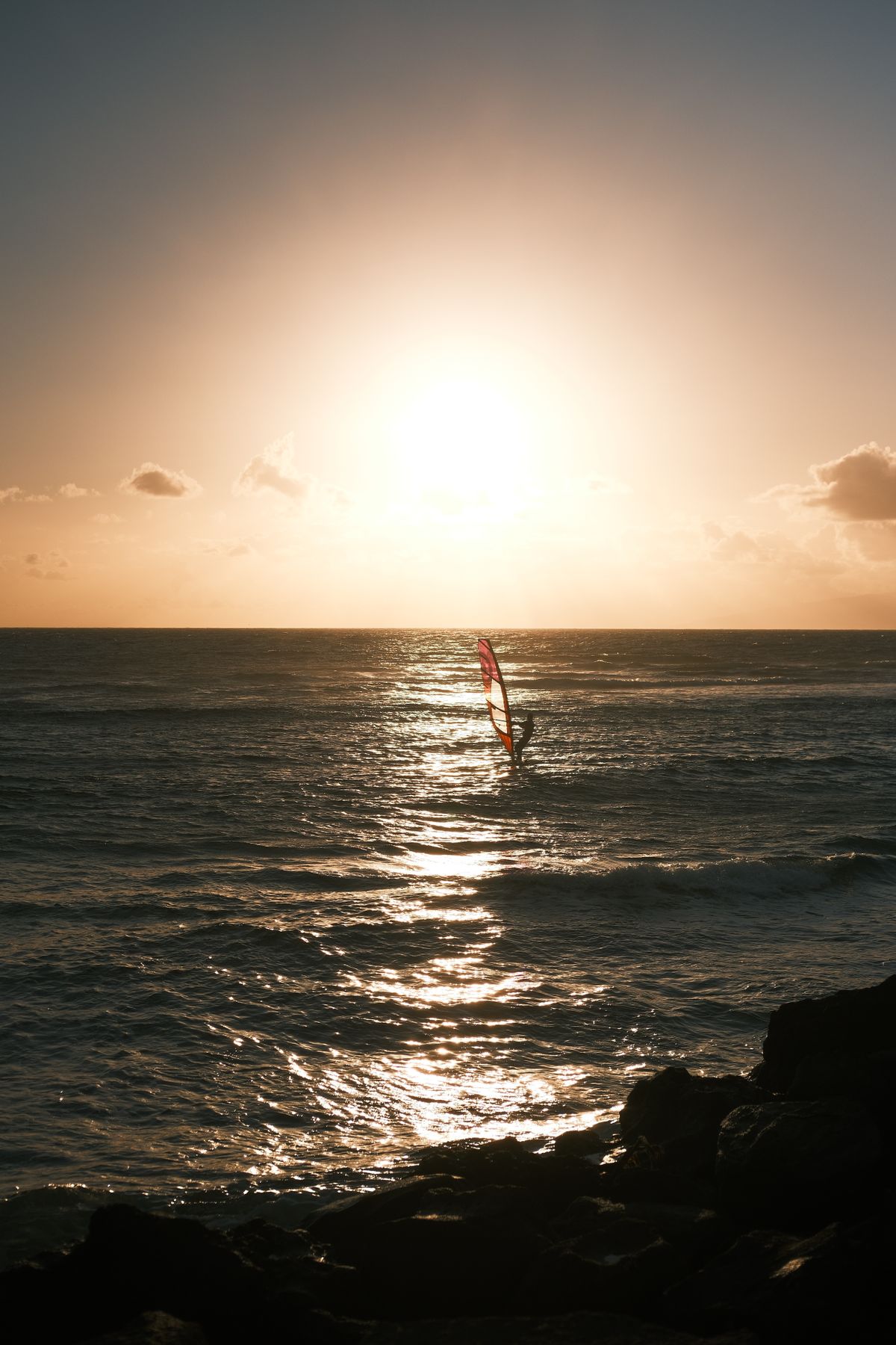 Sailing at sunset on the ocean