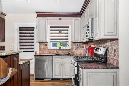Bright kitchen interior with stainless steel appliances and wooden accents.