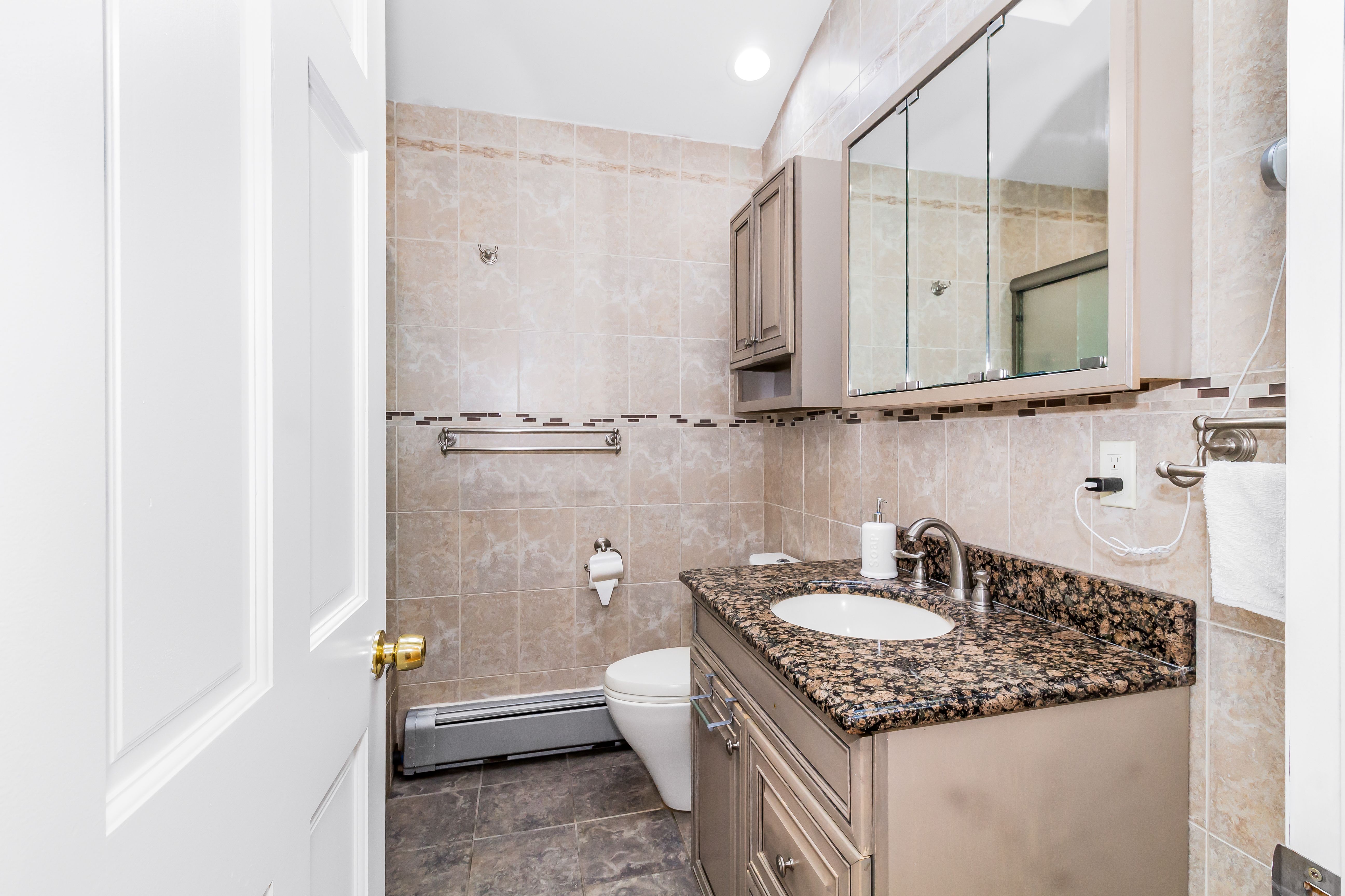 Transitional bathroom blending classic shapes with modern finishes.