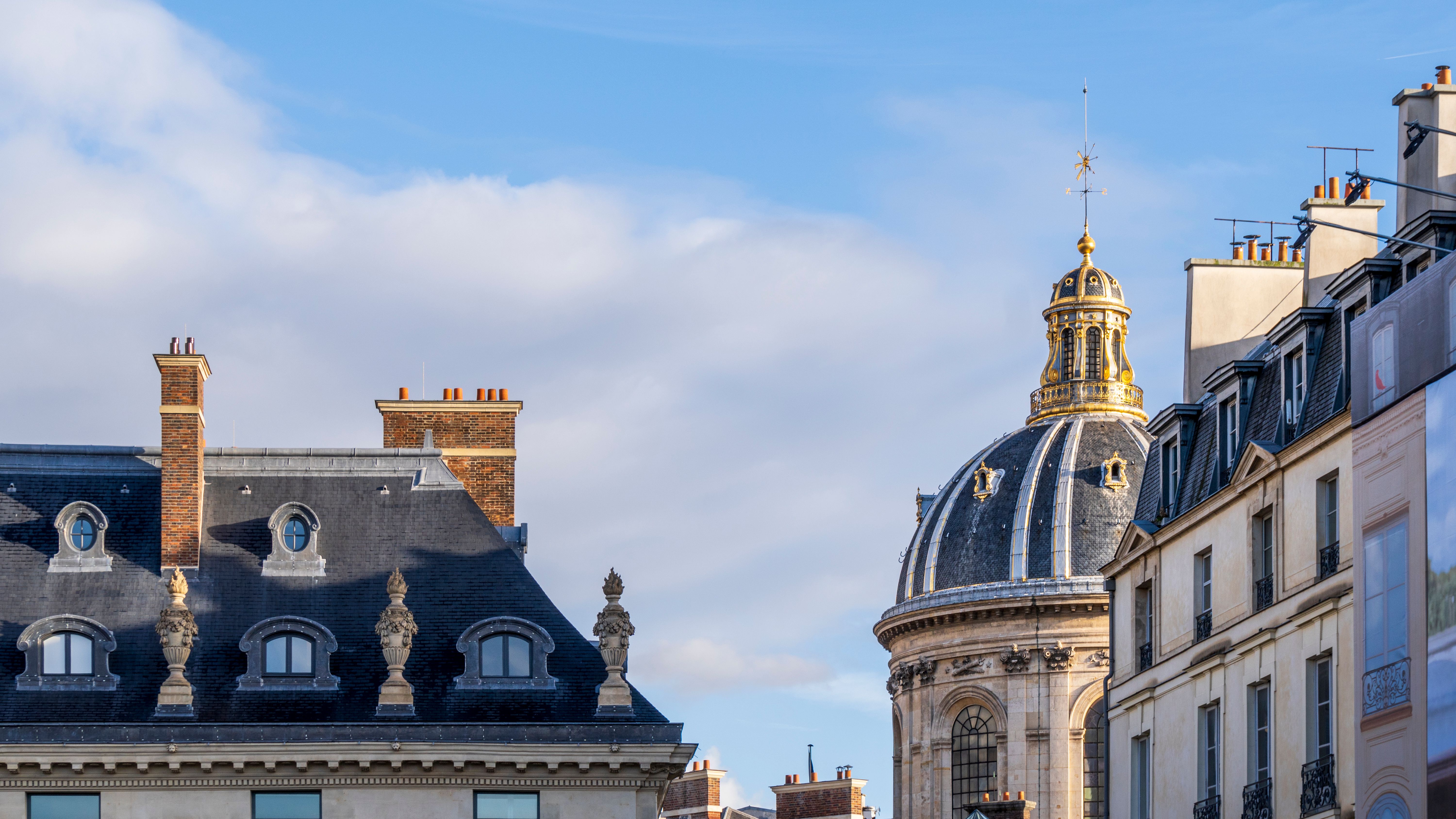 Classic Parisian Rooftops with Historic Architecture · Free Stock Photo