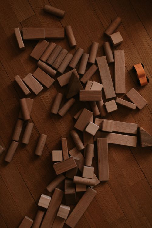 Scattered Blocks Pattern Scattered Wooden Blocks on Wooden Floor · Free Stock Photo