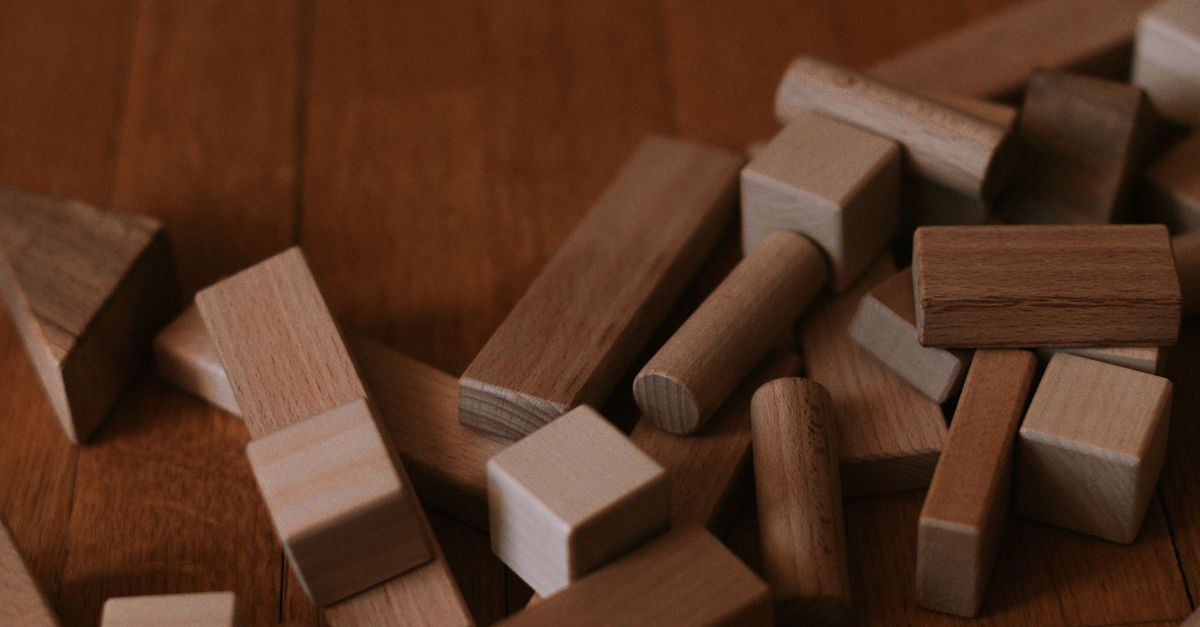 Scattered Blocks Pattern Scattered Wooden Building Blocks on Wooden Floor · Free Stock Photo