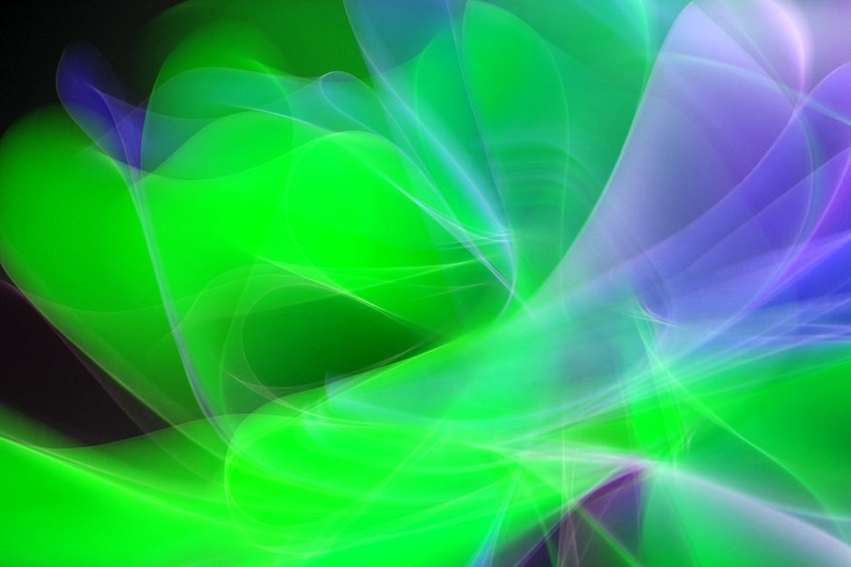 Dynamic abstract composition of vibrant green and purple light streaks.