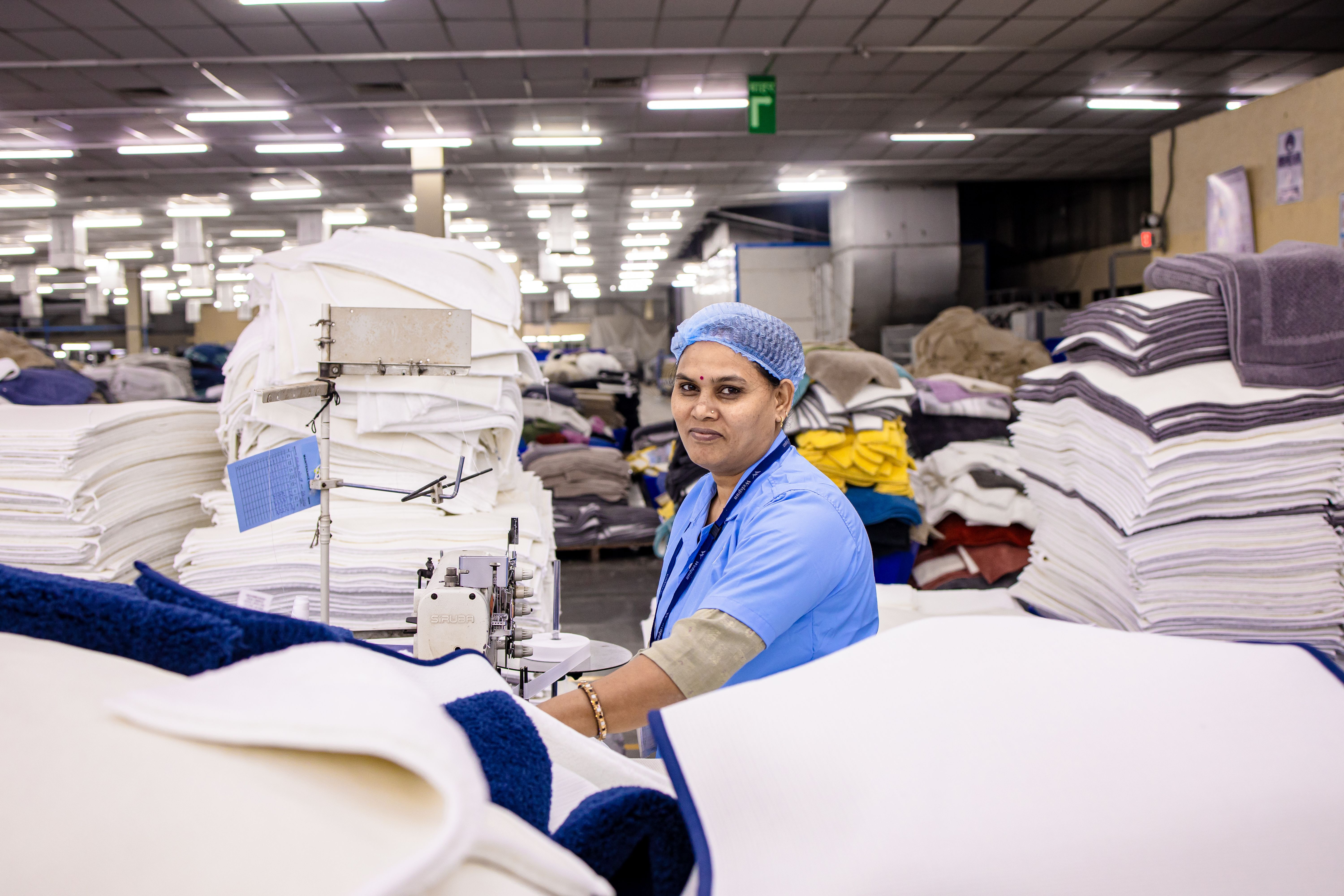 Textile Factory Worker Operating Sewing Machine · Free Stock Photo