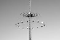 Black and White Carnival Swing Ride Against Sky