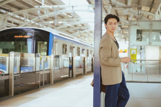 Traveller seated by a train window — photo by Andy Lee on Pexels
