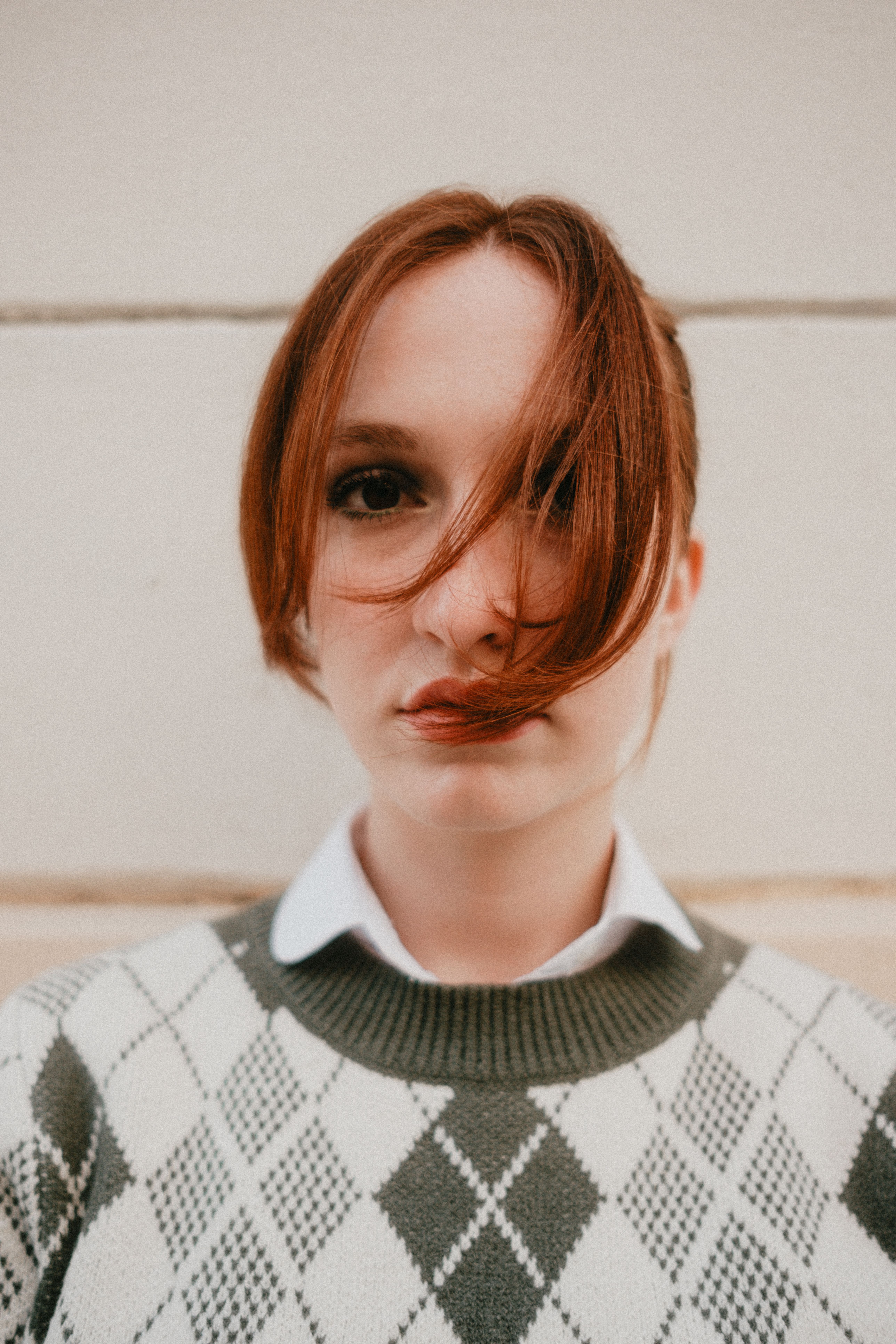 Close-Up Portrait of Woman with Red Hair Outdoors · Free Stock Photo