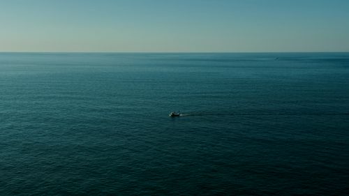 Free A fishing boat sails on the serene Black Sea near Arhavi, Türkiye. Stock Photo