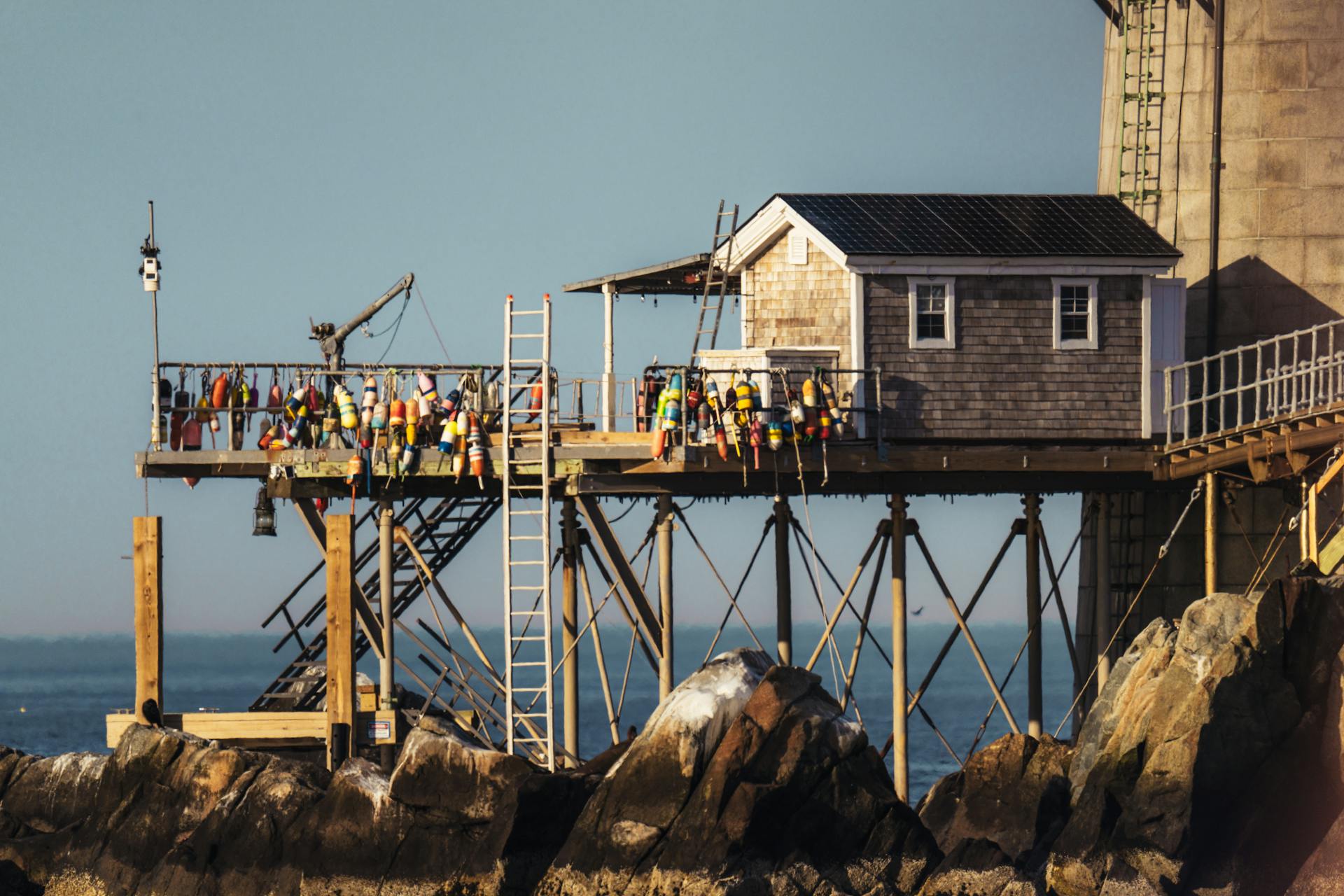 A classic lobster shack on a pier in Boston Harbor, showcasing traditional nautical charm.