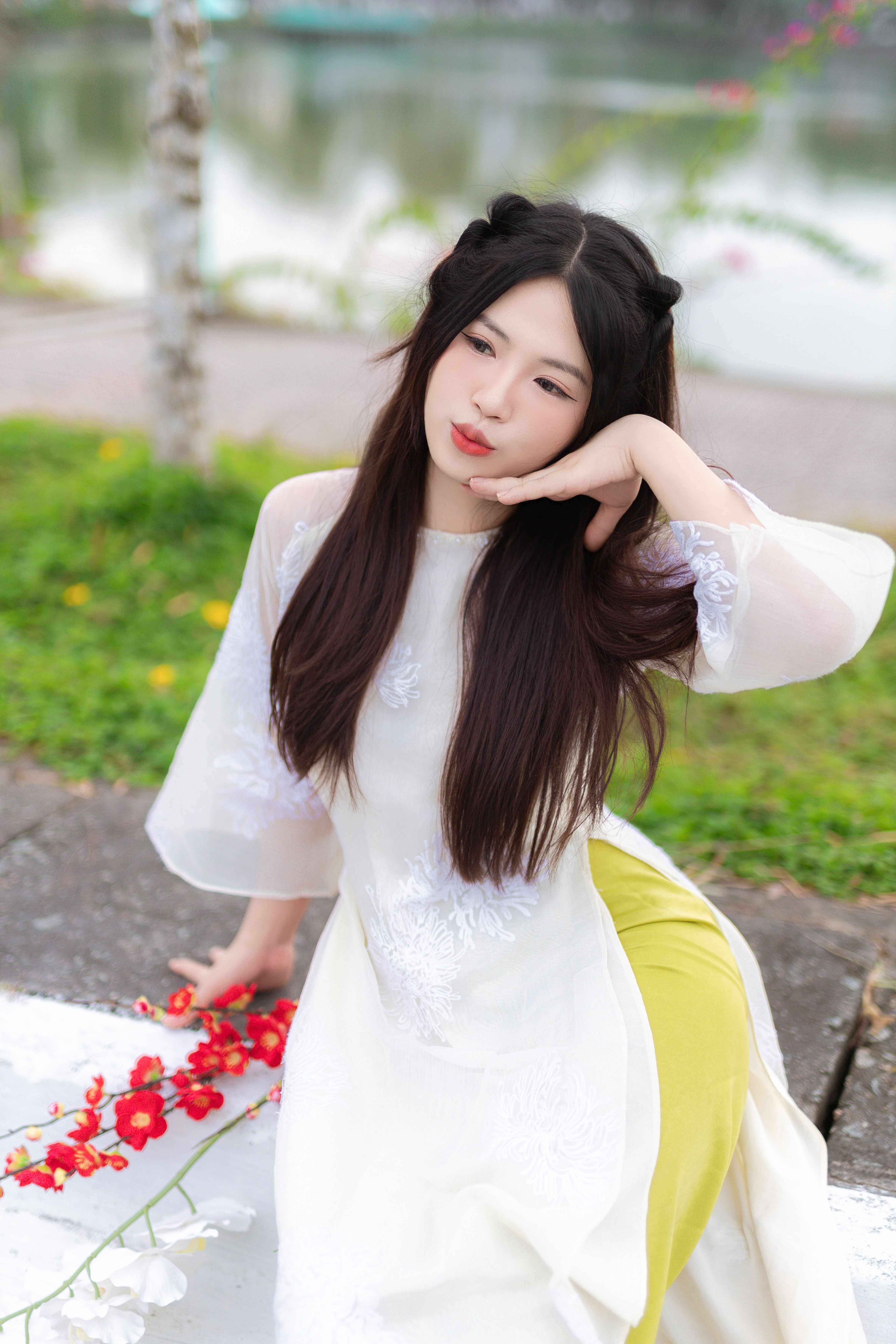 Young Woman Posing Outdoors in Traditional Dress · Free Stock Photo