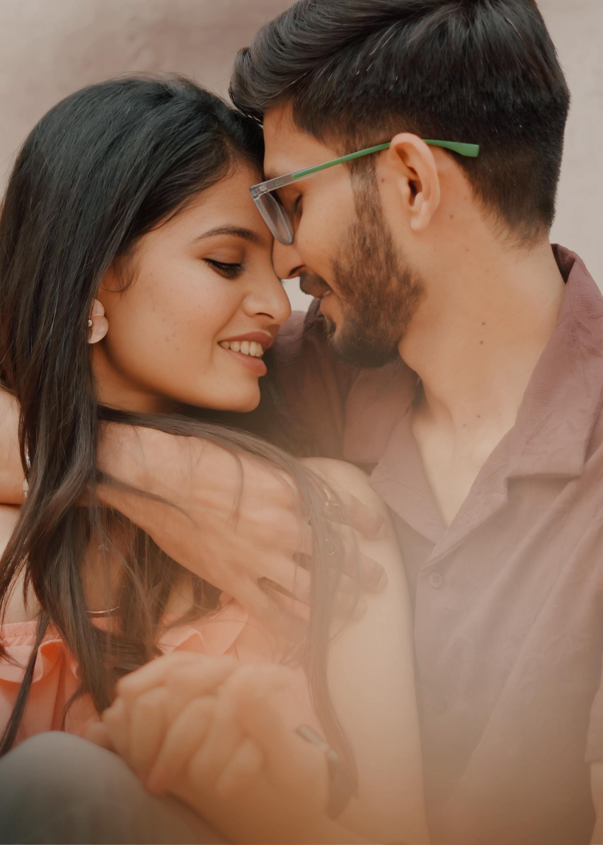 A young couple sharing a loving embrace, symbolizing romance and connection.