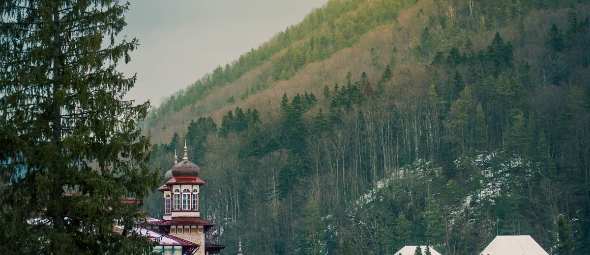 Traditional Romanian building among forested hills