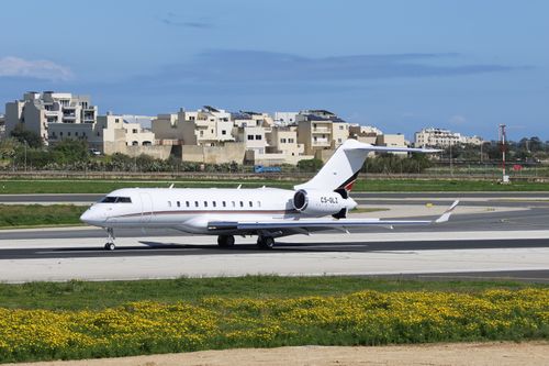 Free A sleek private jet preparing for takeoff on a clear day at a modern airport. Stock Photo
