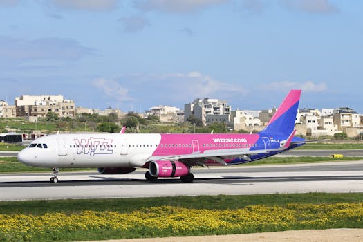 Vibrant aircraft on airport runway with clear skies.