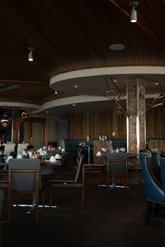 Elegant restaurant interior featuring wooden decor and ambient lighting.