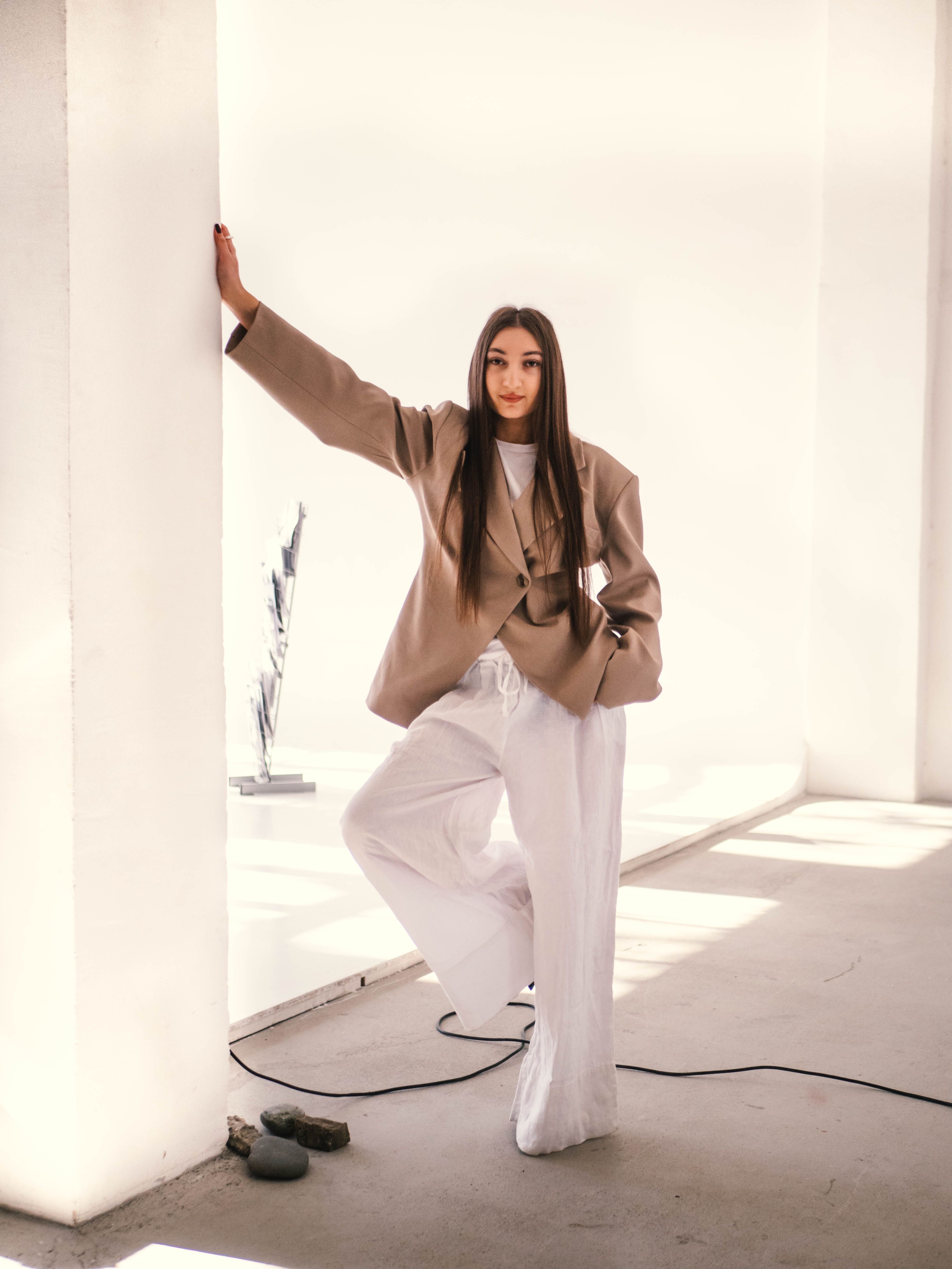 Elegant Woman in Modern Minimalist Interior Setting · Free Stock Photo