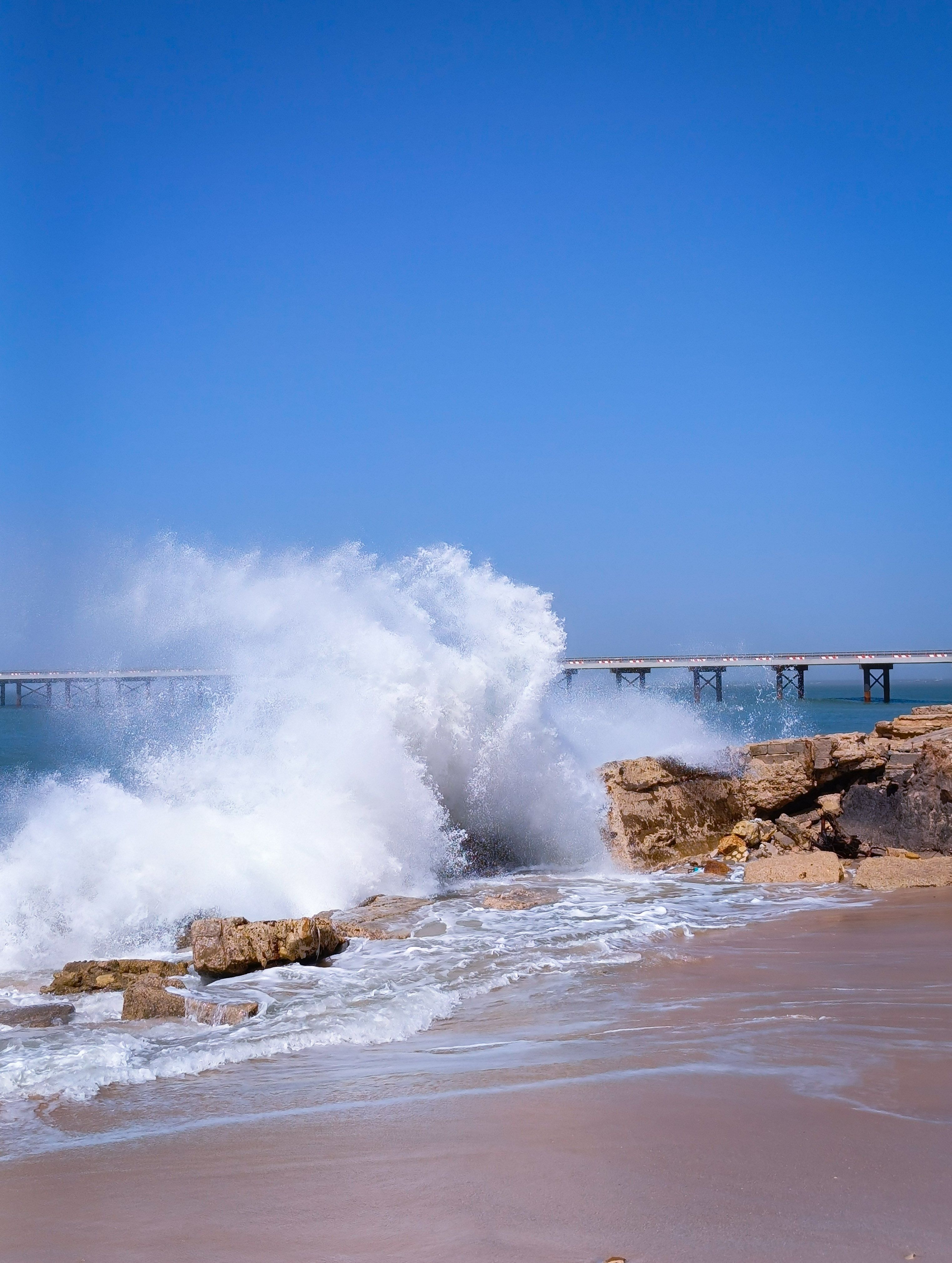 Dramatic Ocean Wave Crashing on Rocky Shore · Free Stock Photo