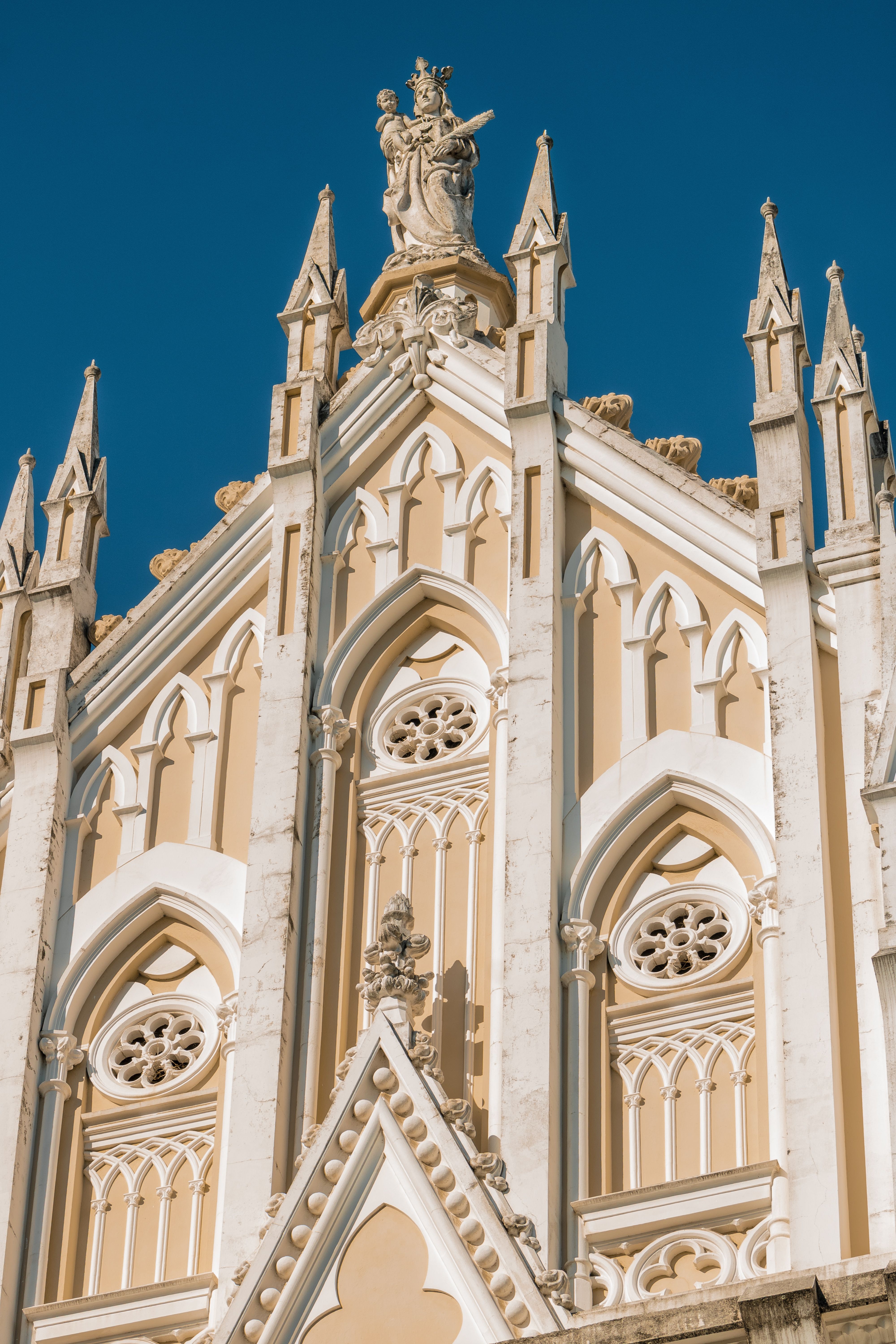 Gothic Revival Church Facade Under Blue Sky · Free Stock Photo